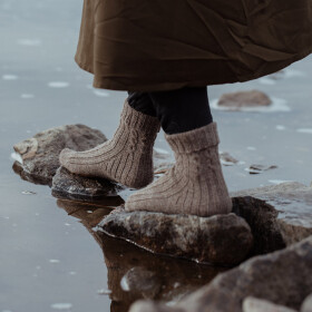 The Island and the Forest: A Knitted Correspondence